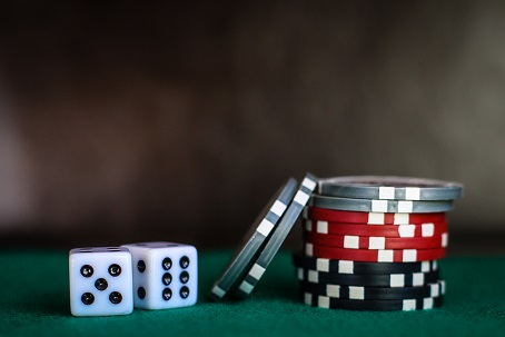 stack of gambling chips and dice