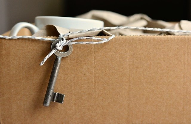 a key dangling off a moving box