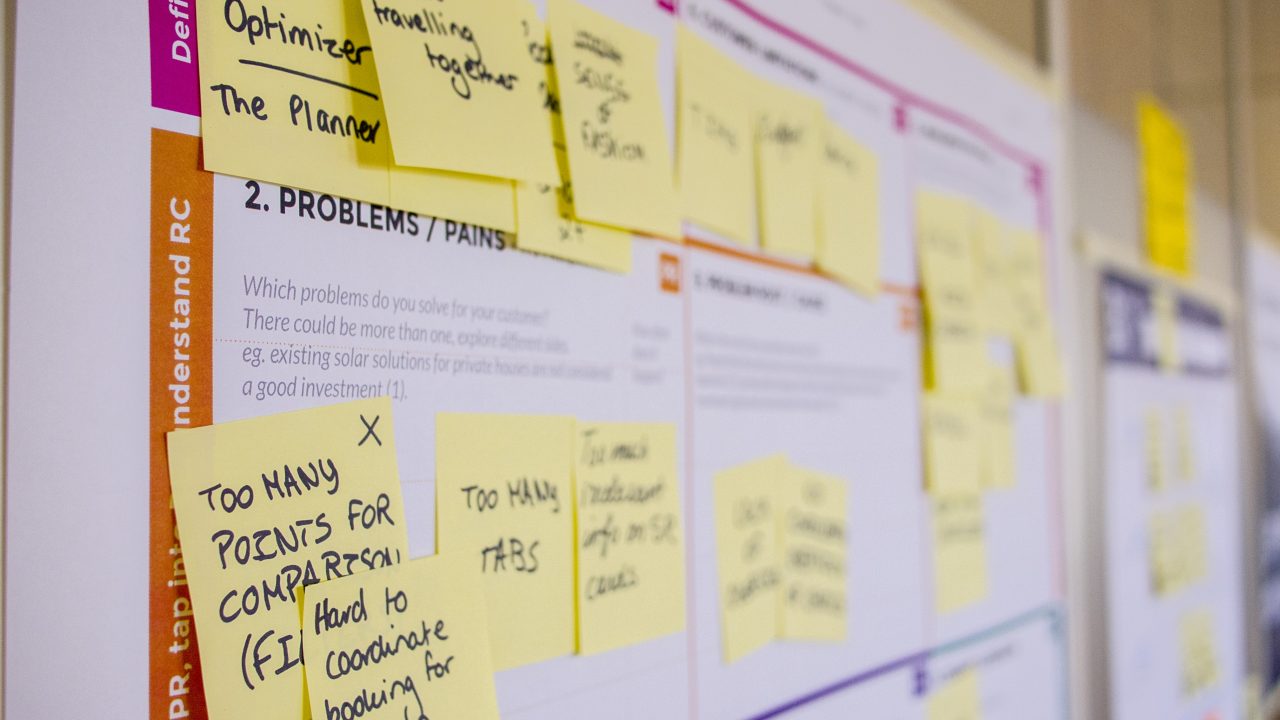 sticky note cork board going over business goals