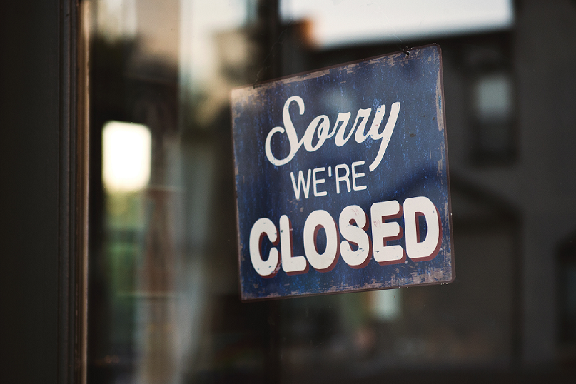 sorry we are closed sign hung up on door