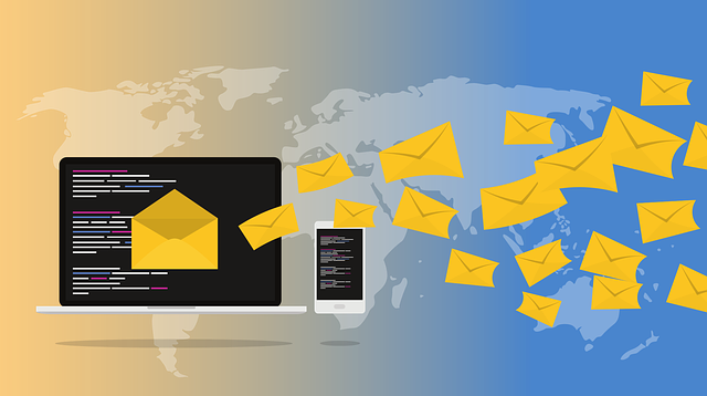 scattered cartoon email icons floating to a desktop and a smartphone