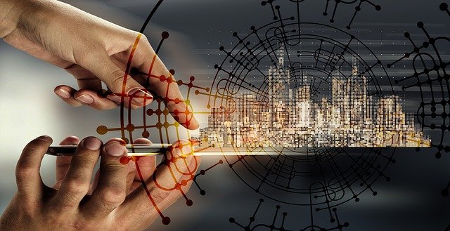 closeup on hands tapping smart phone while a city skyline is superimposed in the background