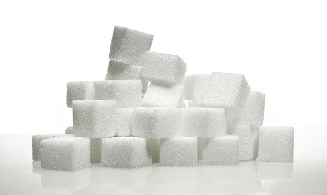 a stack of sugar cubes with a white backdrop