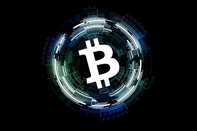 Bitcoin logo with a digital aura on a black background