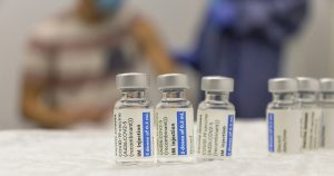 3 vaccine jars lined up side-by-side