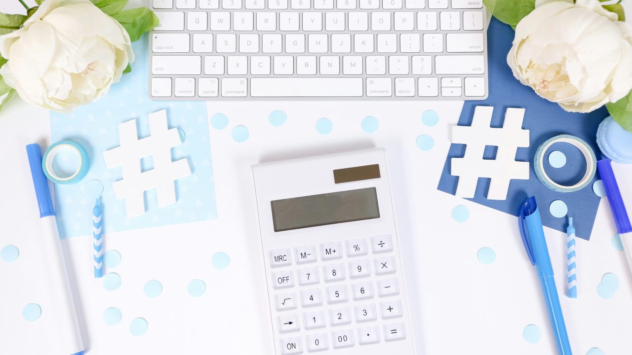 close up of a calculator and keyboard with two hash tags on either side
